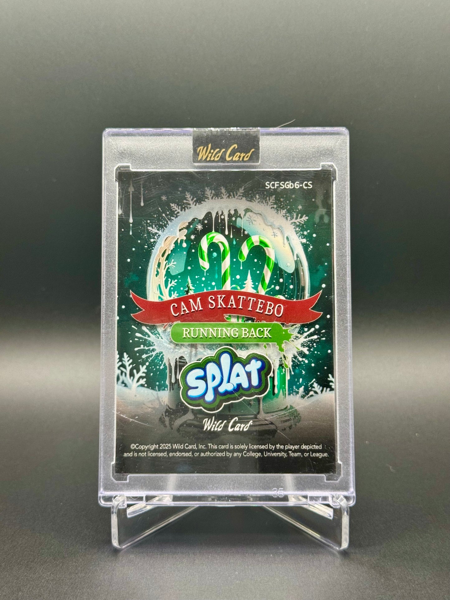 2025 Wild Card Holiday Edition Football Cam Skattebo RC #SCFSGb6-CS Holiday Splat 1/4 Raw Encased