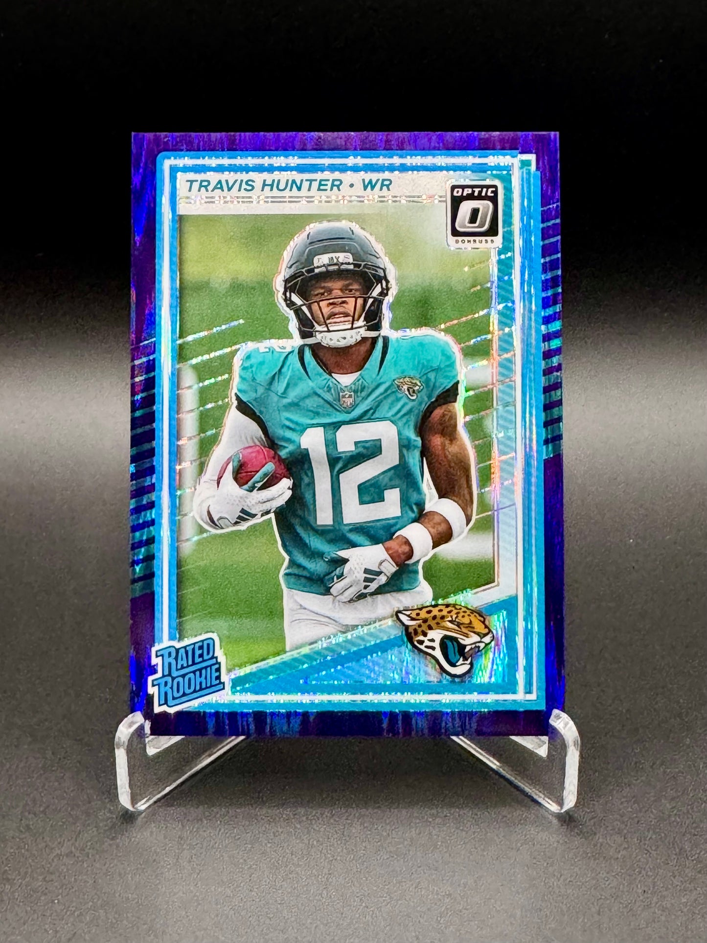 2025 Panini Donruss Optic Travis Hunter RC #201 Rated Rookie Purple Shock Raw
